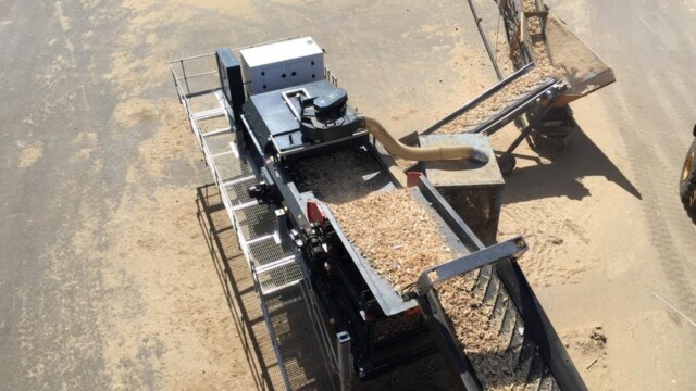 Tracked Eddy Current Separator cleaning woodchip to remove metals and light materials such as plastic and paper